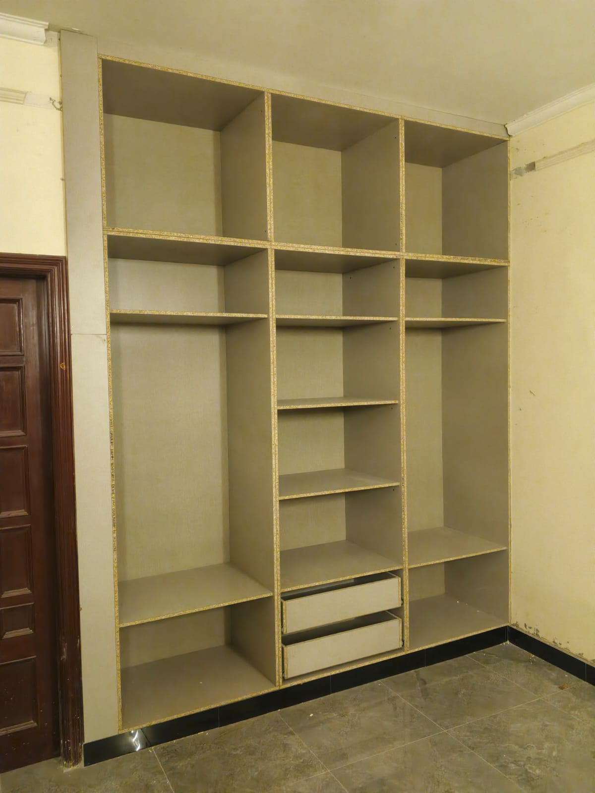 Fitted wardrobe carcass with shelves and drawers before the doors go on