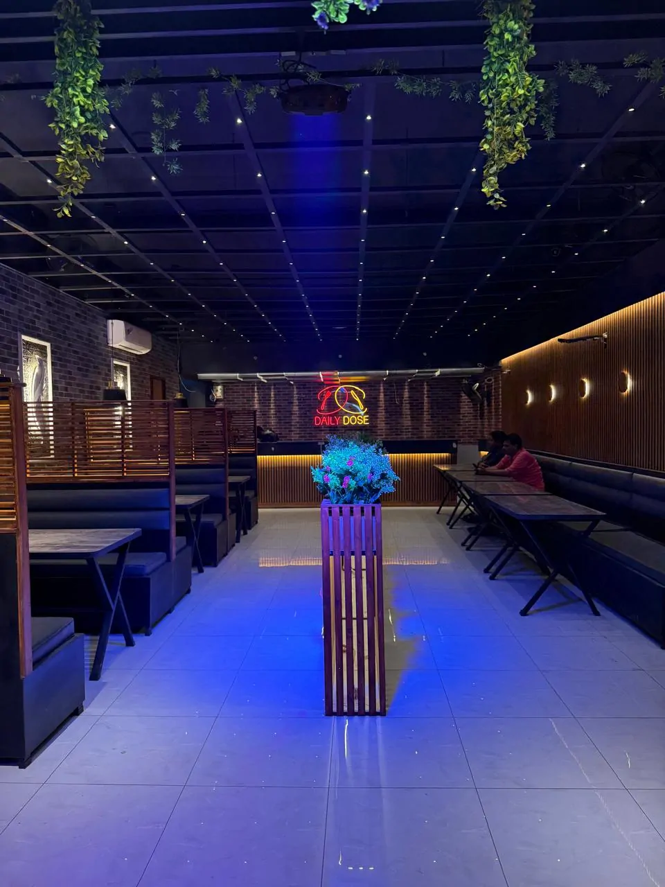 Finished dining hall with booth seating, a starlight ceiling and a slatted timber wall