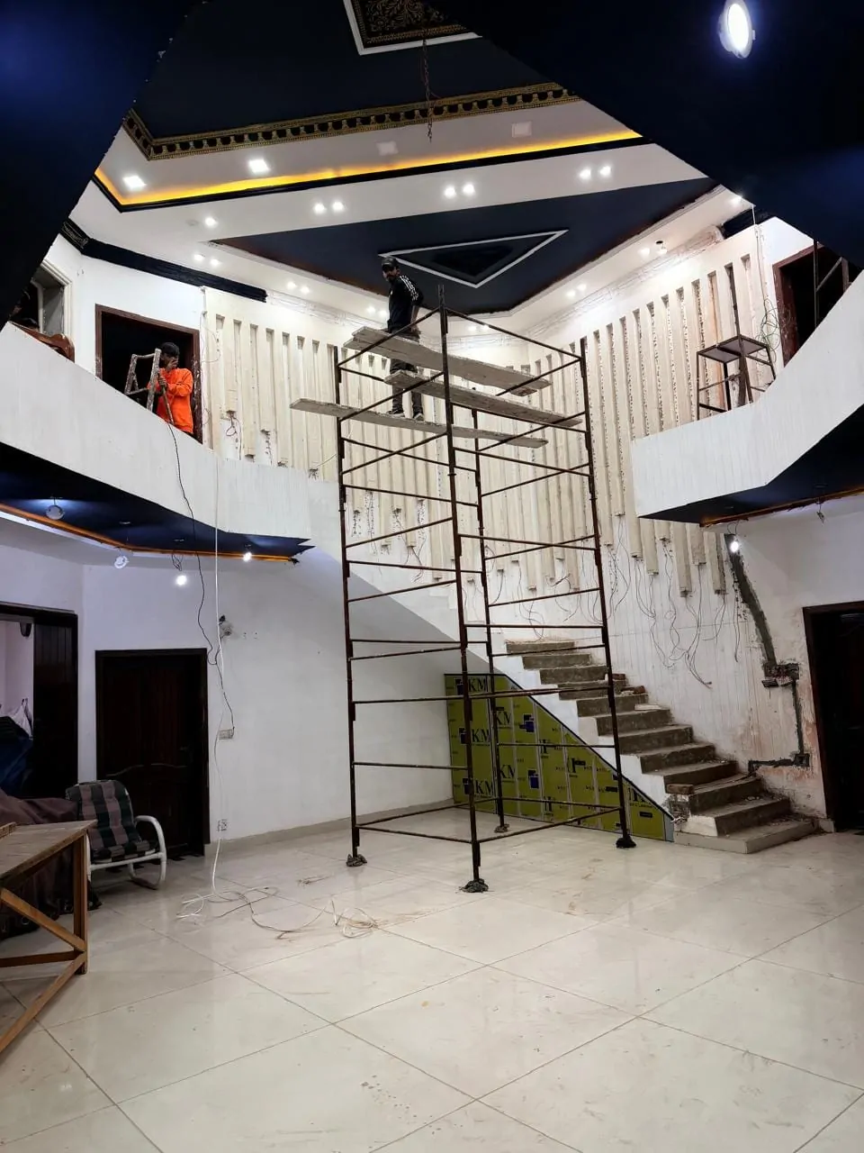 Staircase hall during construction, with scaffolding in place for the feature wall