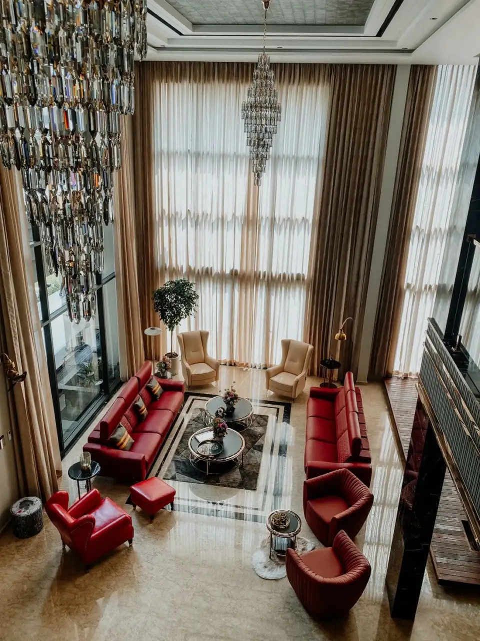 Luxury living area with chandeliers and elegant seating