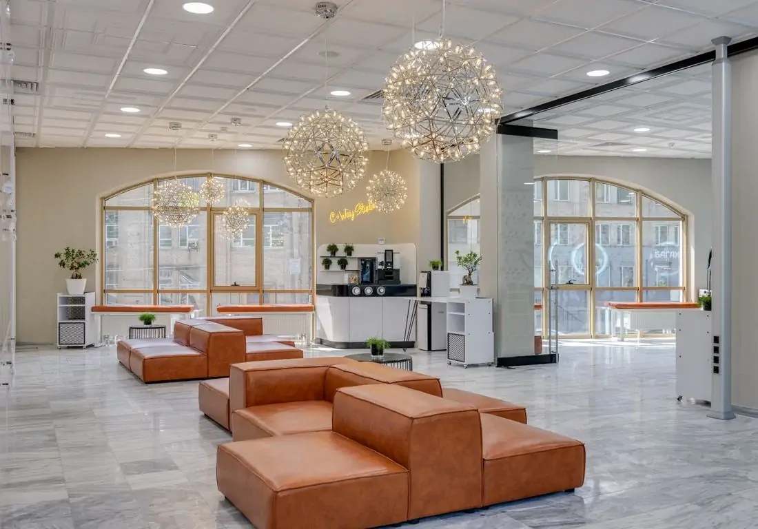Commercial lobby with leather seating and chandeliers
