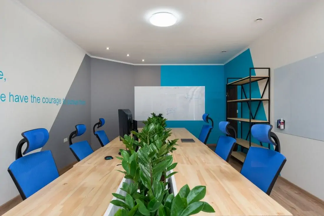 Corporate boardroom with armchairs and plants