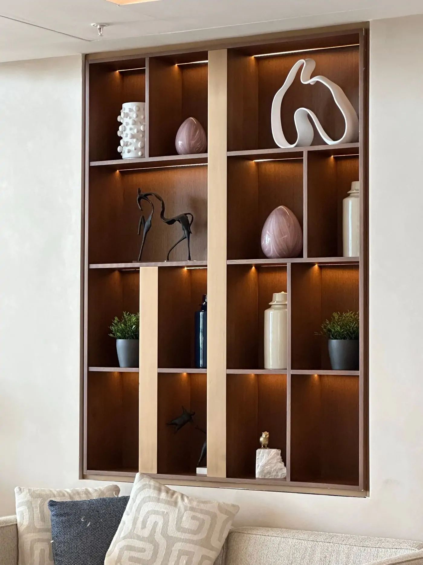 Wooden wall shelving with decorative objects
